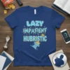 LAZY IMPATIENT HUBRISTIC text design with broken pillar and crowns on a blue t-shirt