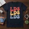 Retro groovy LDS LDS LDS text design in red, yellow, and blue on a navy t-shirt