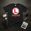Learner Driver Progression t-shirt design with a red L plate graphic and white text
