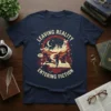 Leaving Reality Entering Fiction t-shirt design with a silhouette of a person standing on an open book, surrounded by magical