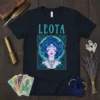 Leota zodiac sign astrology t-shirt featuring a mystical woman with blue curly hair and celestial elements, text 'LEOTA' above