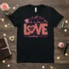 Black t-shirt with pink and gold "Let all that you do be done in LOVE 1 corinthians 16:14" design featuring