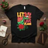 Let Love Bloom text design with a robin, rose, and flowers on a black t-shirt