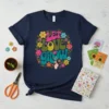 Let Love Grow retro floral t-shirt with colorful flowers and groovy font, featuring a hand gesture
