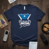 Navy blue t-shirt with "Let Me Ask My Mom" in white text inside a speech bubble, featuring a blue superhero
