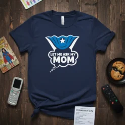 Navy blue t-shirt with "Let Me Ask My Mom" in white text inside a speech bubble, featuring a blue superhero