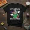 Let's Eat Trash & Get Hit By A Car humorous quote on a black t-shirt featuring a possum in a