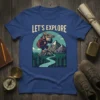 Let's Explore t-shirt design with a monkey wearing a hat and backpack looking through binoculars at mountains