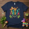 Navy blue t-shirt with colorful "Let's FIESTA" text, sombrero, guitar, cacti, and festive bunting graphic