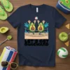 Let's Get Guacward t-shirt with cartoon avocados playing volleyball on a beach court