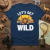 Let's Get Wild safari t-shirt design featuring a lion, giraffes, elephants, and rhinos under a sunset
