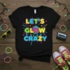Black t-shirt with "LET'S GLOW CRAZY" text and disco ball graphic in bright neon colors