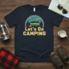 Let's Go CAMPING t-shirt design with a green camper van, campfire, trees, moon, and stars