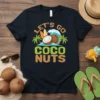 Let's Go Coco Nuts t-shirt design with coconuts, surfboards, palm trees, and ocean waves