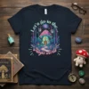Let's go to the Magic world text with psychedelic mushroom house in a fantasy forest graphic on a navy t-shirt