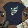 Let's Gooo! Adventure Waits! text with a rocket graphic on a navy blue t-shirt, promoting travel and adventure