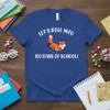Blue t-shirt with "Let's roll into 100 days of school!" text and a cute cartoon fox on wheels