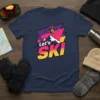 Let's Ski retro design t-shirt with a skier on a mountain peak, vibrant pink and yellow colors