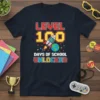Level 100 Days of School Unlocked T-Shirt with pixelated text, rocket, and Earth graphic