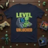 Level 13 Unlocked t-shirt design with an alien playing video games and glowing text