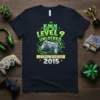 Level 9 Unlocked Awesome Since 2015 gamer birthday t-shirt design with video game controller and castle graphic