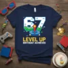 Level Up 67 Birthday Achieved gamer t-shirt with pixelated number 67, joystick, and gaming controller graphic