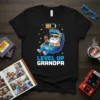 Level Up Grandpa text with a pixelated Santa Claus character playing a video game on a retro arcade machine