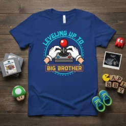 Leveling Up To Big Brother t-shirt with pixelated joystick and text in blue and orange