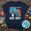 T-shirt with "Levelled Up To Big Boy" text and pixelated character with arcade machine graphic