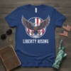 Liberty Rising T-Shirt with a bald eagle holding scrolls against an American flag background
