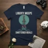 Liberty Weeps Shattered Ideals t-shirt design with Statue of Liberty torch shattering, chains, and bold text