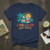 Librarian Off Duty text with stack of books, palm trees, and sun graphic on a navy t-shirt
