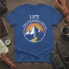 LIFE begins at the end of your comfort zone quote on a blue t-shirt with a mountain graphic