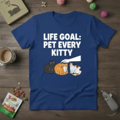 Life Goal: Pet Every Kitty t-shirt design featuring white text above three cute cartoon cats and a hand petting one