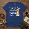 Life Happens Dogs Help quote with paw prints and a happy dog graphic on a navy t-shirt