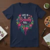 T-shirt with "LIFE IS Beauty FULL" text inside a colorful floral wreath design