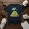 Life Is Better With Cricket text and graphic featuring a cricket bat, ball, and wickets on a dark t-shirt