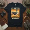 Graphic t-shirt with text "Life Is Better With Emus" and a cartoon emu running in a desert landscape