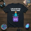 Life Is Better With A Gonk quote with a cute purple monster wearing a party hat on a black t-shirt