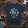 T-shirt with colorful circular design showing icons for coffee, gym, travel, and relaxation with text "Life is full of choices"