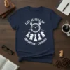 White text and chess pieces design on a navy t-shirt, featuring the quote "Life is Full of Important Choices" around