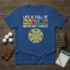 Blue t-shirt with "LIFE IS FULL OF IMPORTANT CHOICES" text and golf club icons, featuring a circular design of golf