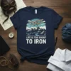 T-shirt with "Life Is Too Short To Iron" text and biplane flying over mountains graphic