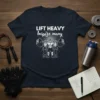 T-shirt with "Lift Heavy Inspire Many" text and a graphic of a bodybuilder lifting weights with two figures cheering him