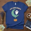 Blue t-shirt with "LIFT YOUR SPIRITS" text, a cute ghost, crescent moon, hot air balloon, and pumpkin graphic