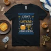 Light Latkas Hanukkah t-shirt with a festive design featuring latkes, a menorah, and dreidels, in a blue and yellow knitted