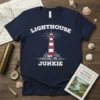 Lighthouse Junkie t-shirt design featuring a classic red and white lighthouse with waves and trees, text reads "LIGHTHOUSE JUNKIE"