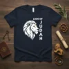 Lion of Judah text design with a majestic white lion head graphic on a navy t-shirt