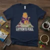 Litter's Full t-shirt design featuring a grumpy cat king sitting on a pile of litter with cat food bowls