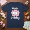 Navy blue t-shirt with "little bunny" text and a cute sleeping white bunny on a pink flower graphic